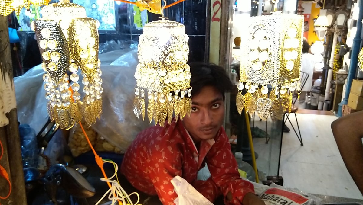 Govind selling e-diyas and small decorative lamps at Bhagirath Place, Delhi 