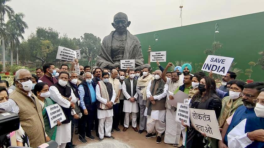 Opposition MPs protesting the suspension of 12 MPs for alleged 'unruly behaviour' in Monsoon session