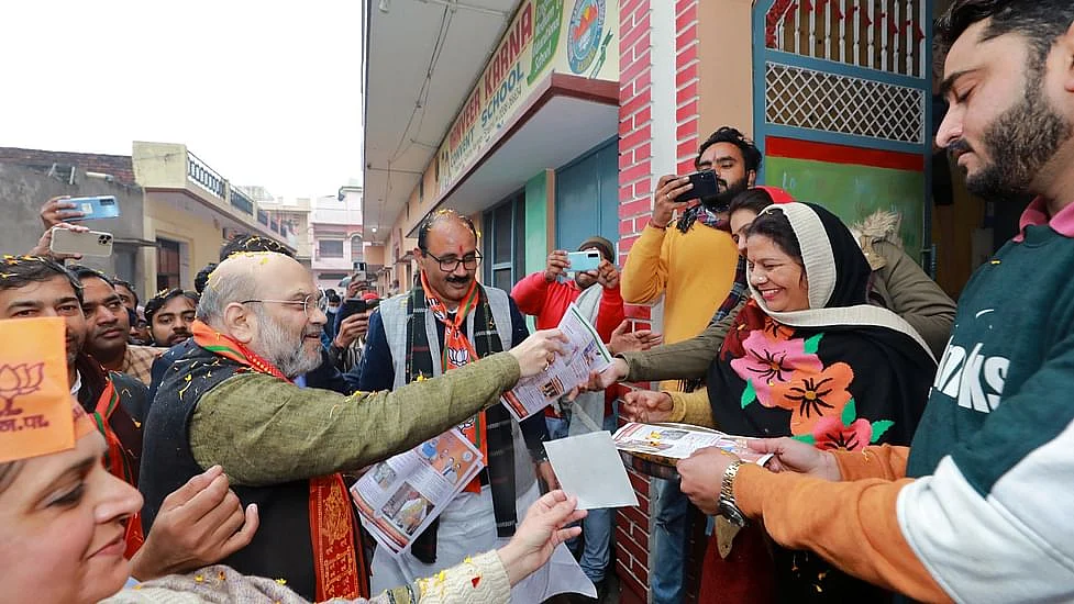 Union Home Minister Amit Shah during door-to-door campaign in UP's Kairana 
