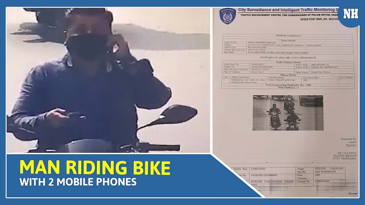 Vadodara Police issues e-challan to the man who was riding bike with 2 mobile phones 