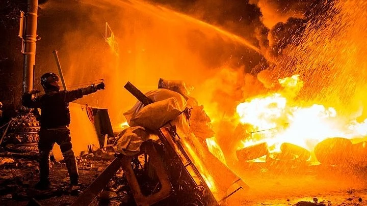 Ukrainian civilians through Molotovs at invading Russian armoured vehicles in capital Kyiv 