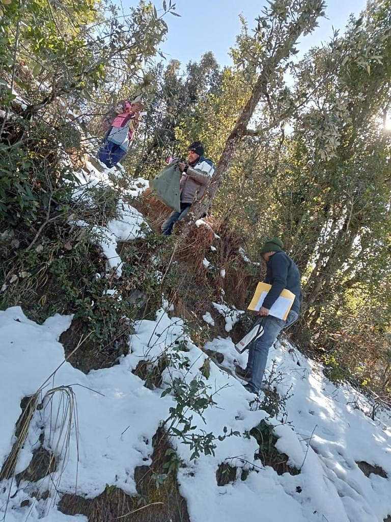 Polling officers make their way to polling station in the higher reaches of Uttarakhand on Sunday