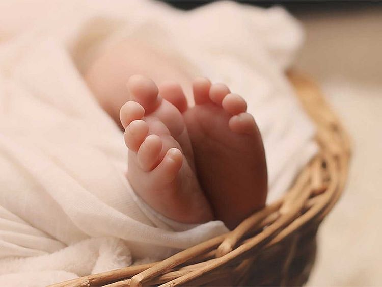 After mix-up at birth, woman reunited with son after DNA match