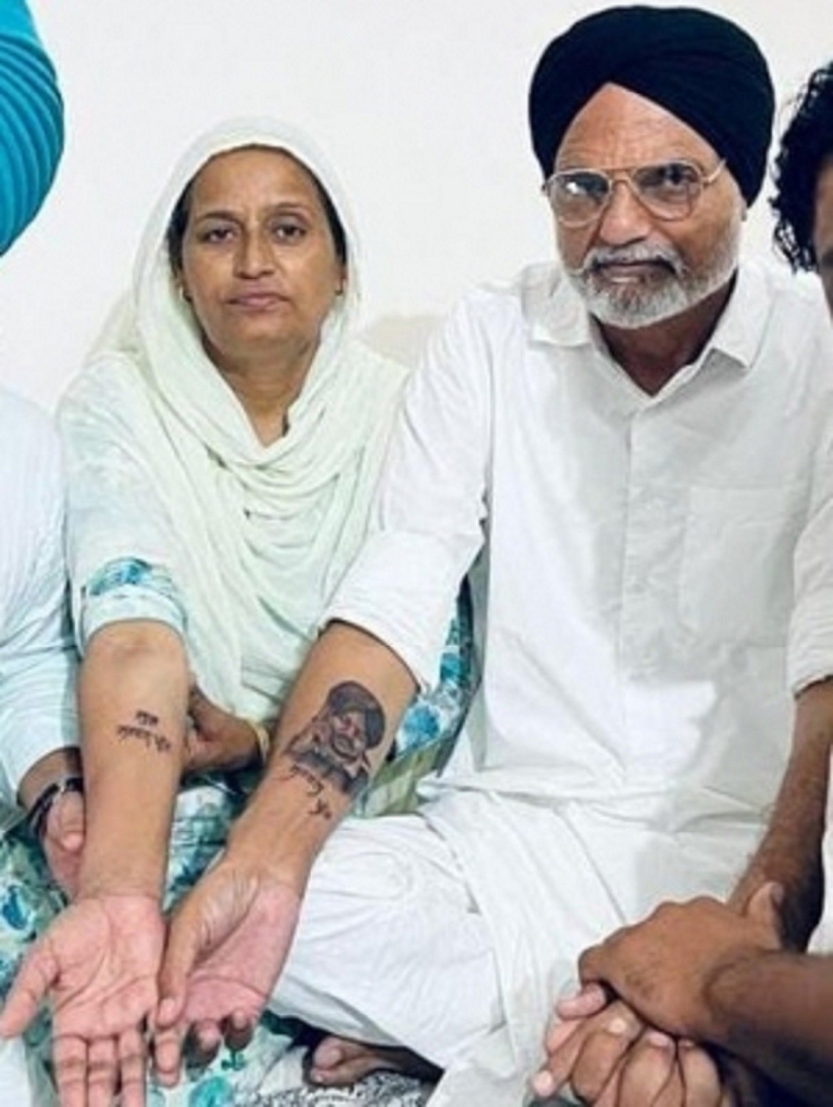 Moose Wala's parents get son's face tattooed on their arms