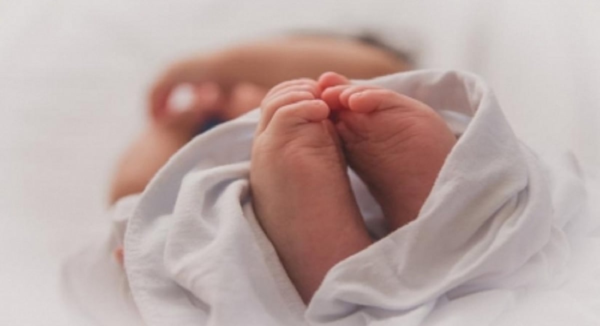 UP woman throws child in front of tractor