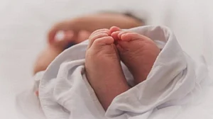 UP woman throws child in front of tractor
