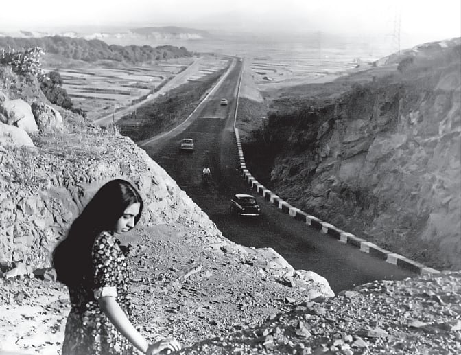 Aparajita standing above the Bombay-Poona Highway, mid 1960s, by Manobina Roy