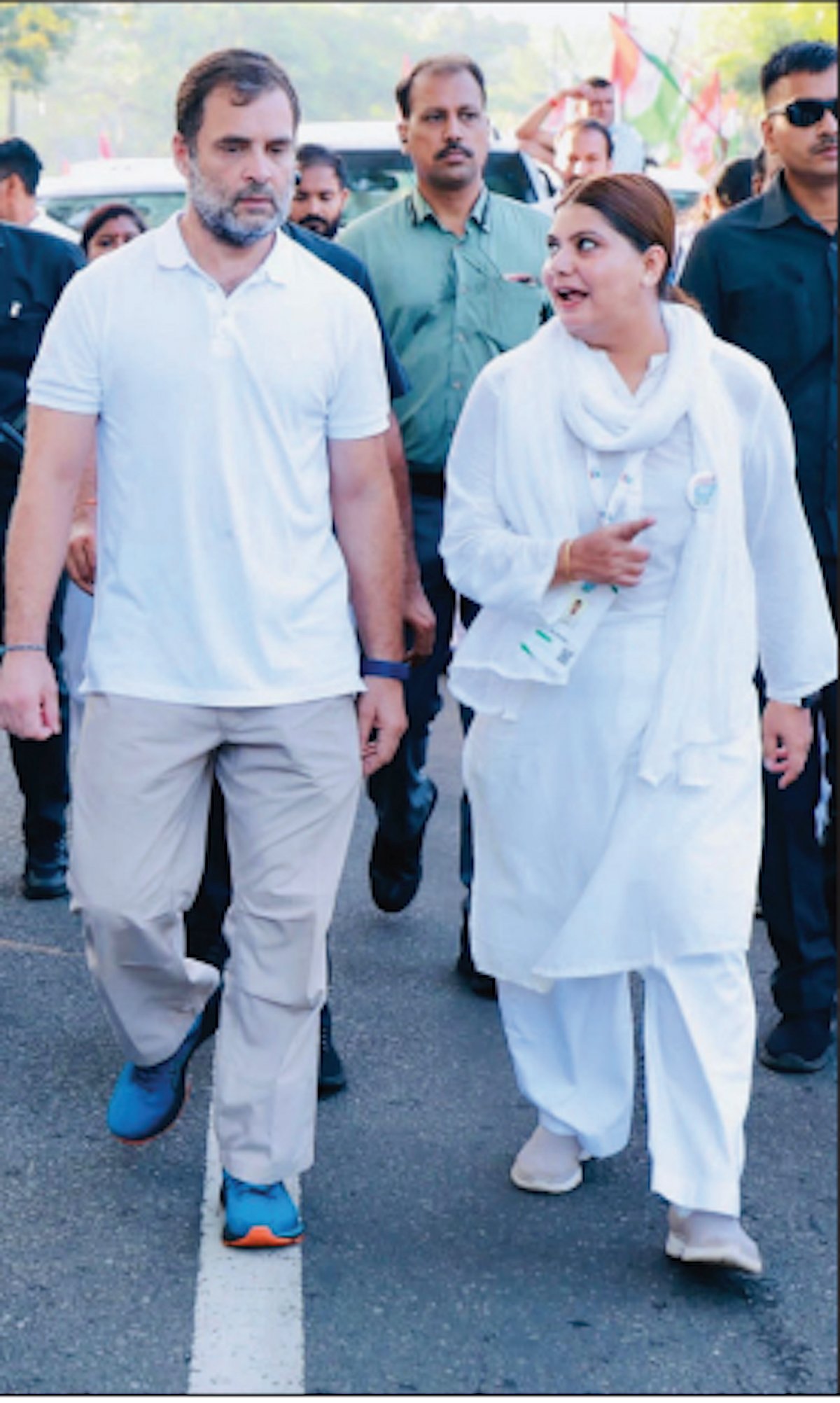 Noori Khan walking with Rahul Gandhi (Photos: Twitter/@INC)