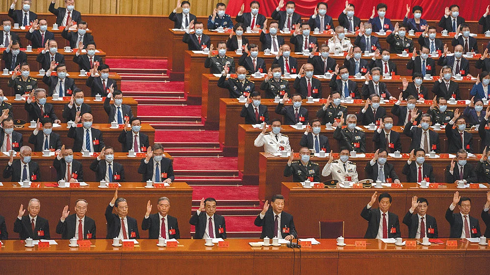 Chinese President Xi Jinping (centre) and other senior members of the government at the Great Hall of the People in Beijing on 22 October (Photo: Getty Images)