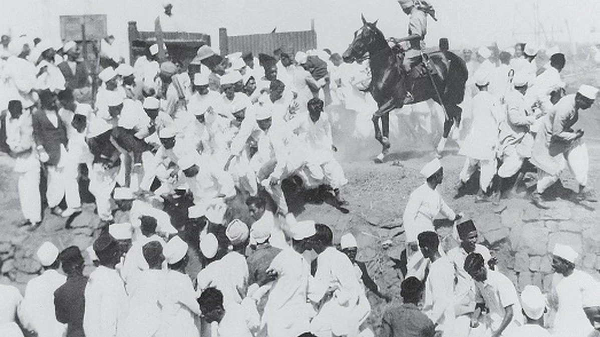 A mounted policeman disperses a crowd gathered at the salt works in Mumbai's Wadala following Gandhi's call for civil disobedience. Over 300 people were injured