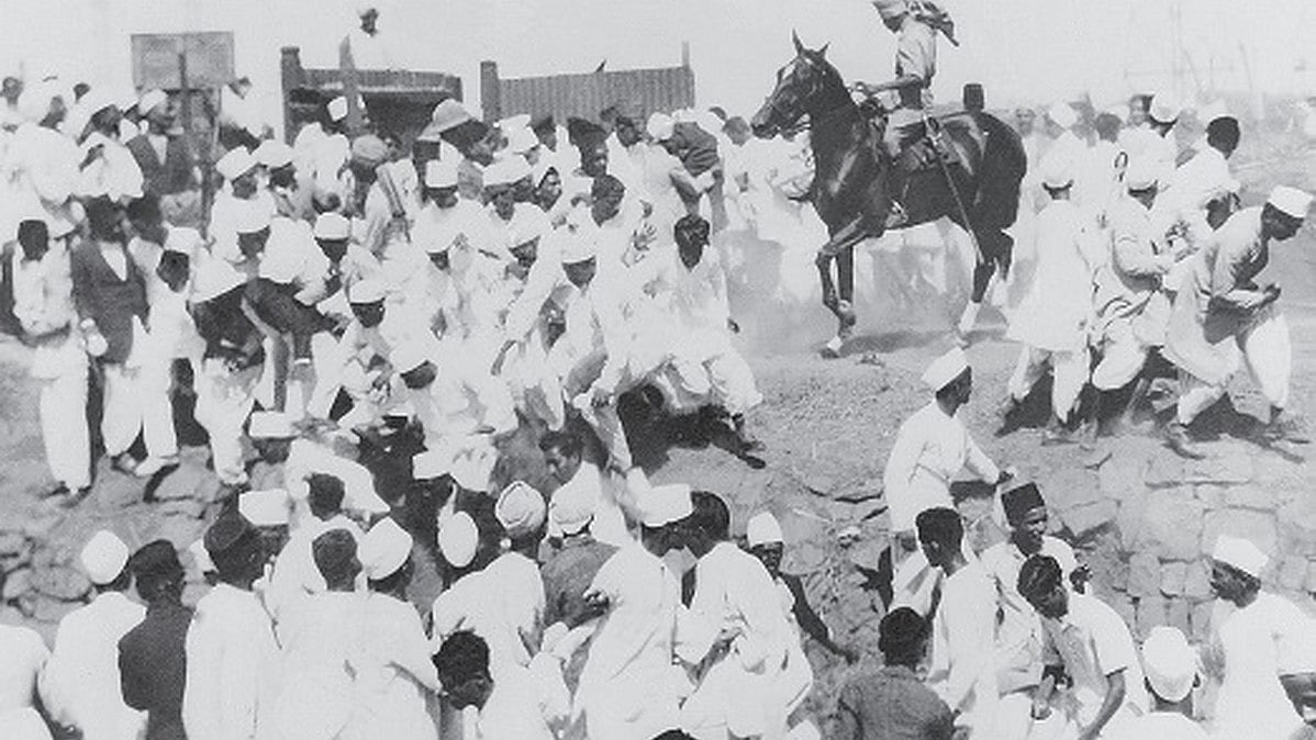 A mounted policeman disperses a crowd gathered at the salt works in Mumbai's Wadala following Gandhi's call for civil disobedience. Over 300 people were injured