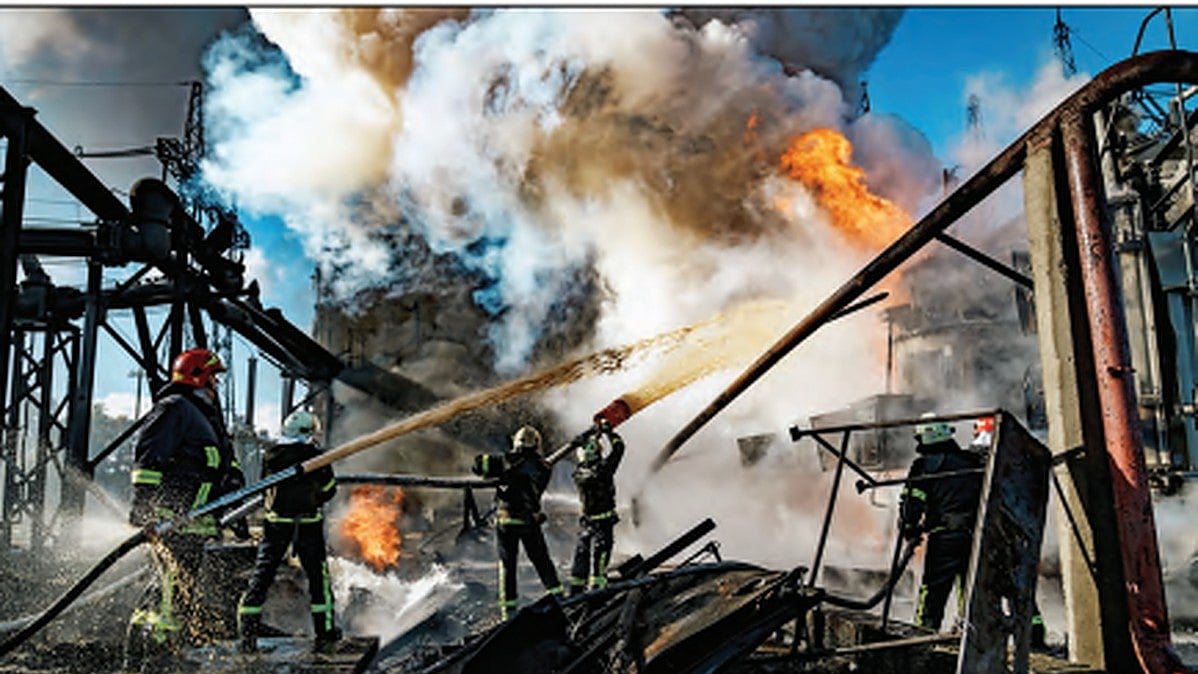 Plumes of smoke billow out of a power station hit by a Russian missile on Oct. 10, 2022, in Kyiv, Ukraine.
