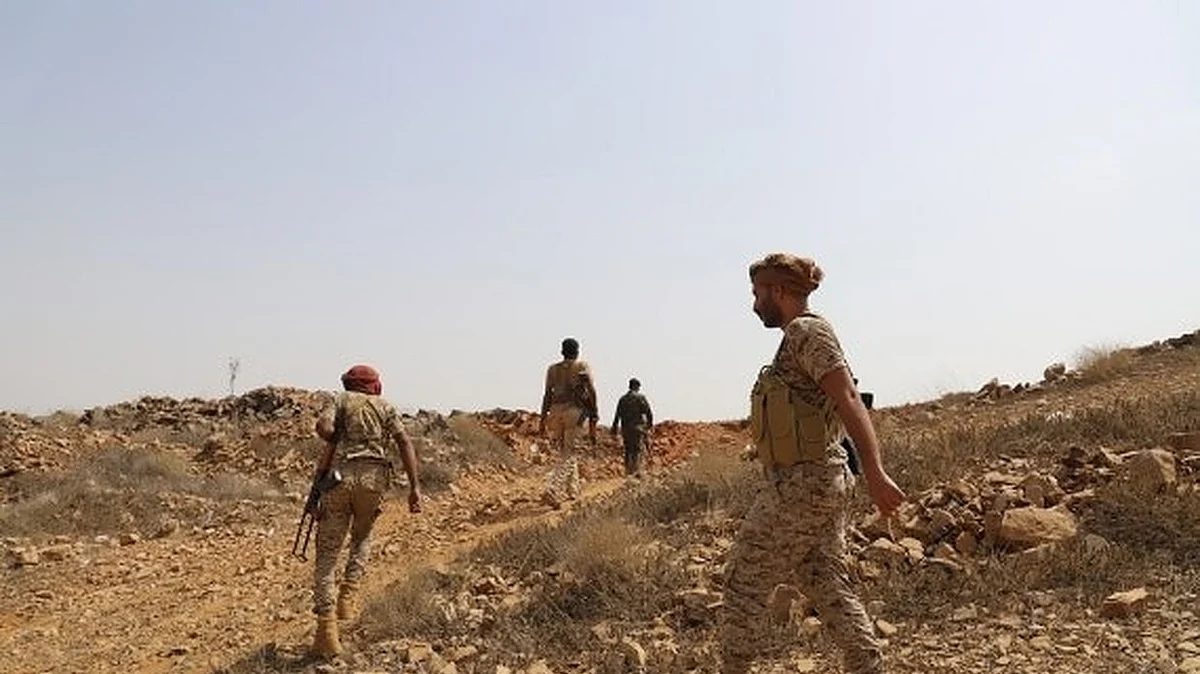 Yemeni government soldiers patrol in Harad district of Hajjah province.