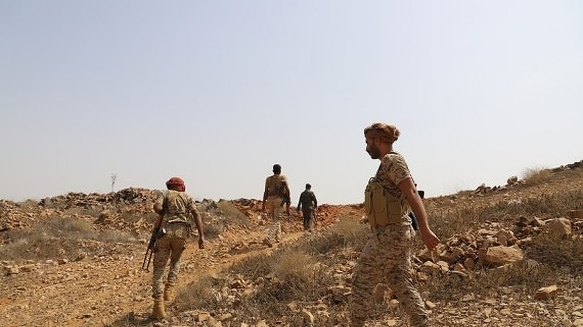 Yemeni government soldiers patrol in Harad district of Hajjah province.