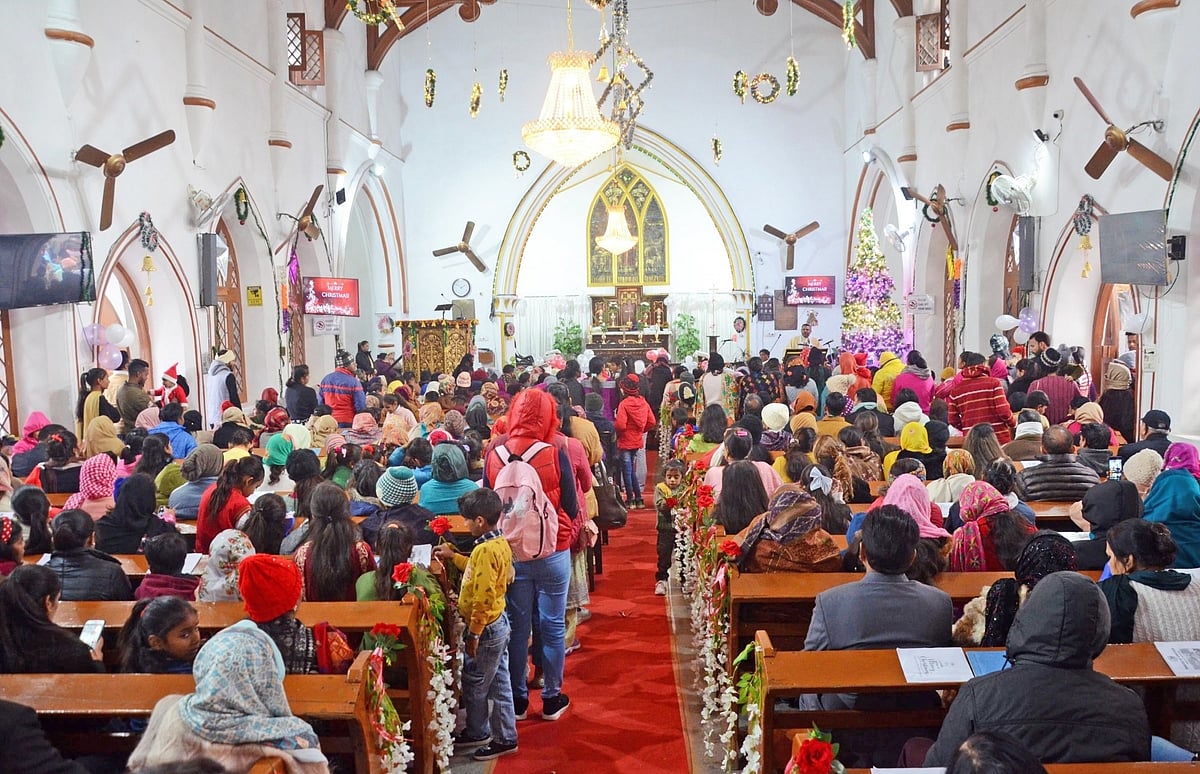 Christian devotees attend mass prayers on the occasion of Christmas at a church in Amritsar on Sunday, 25 Dec. 2022. 