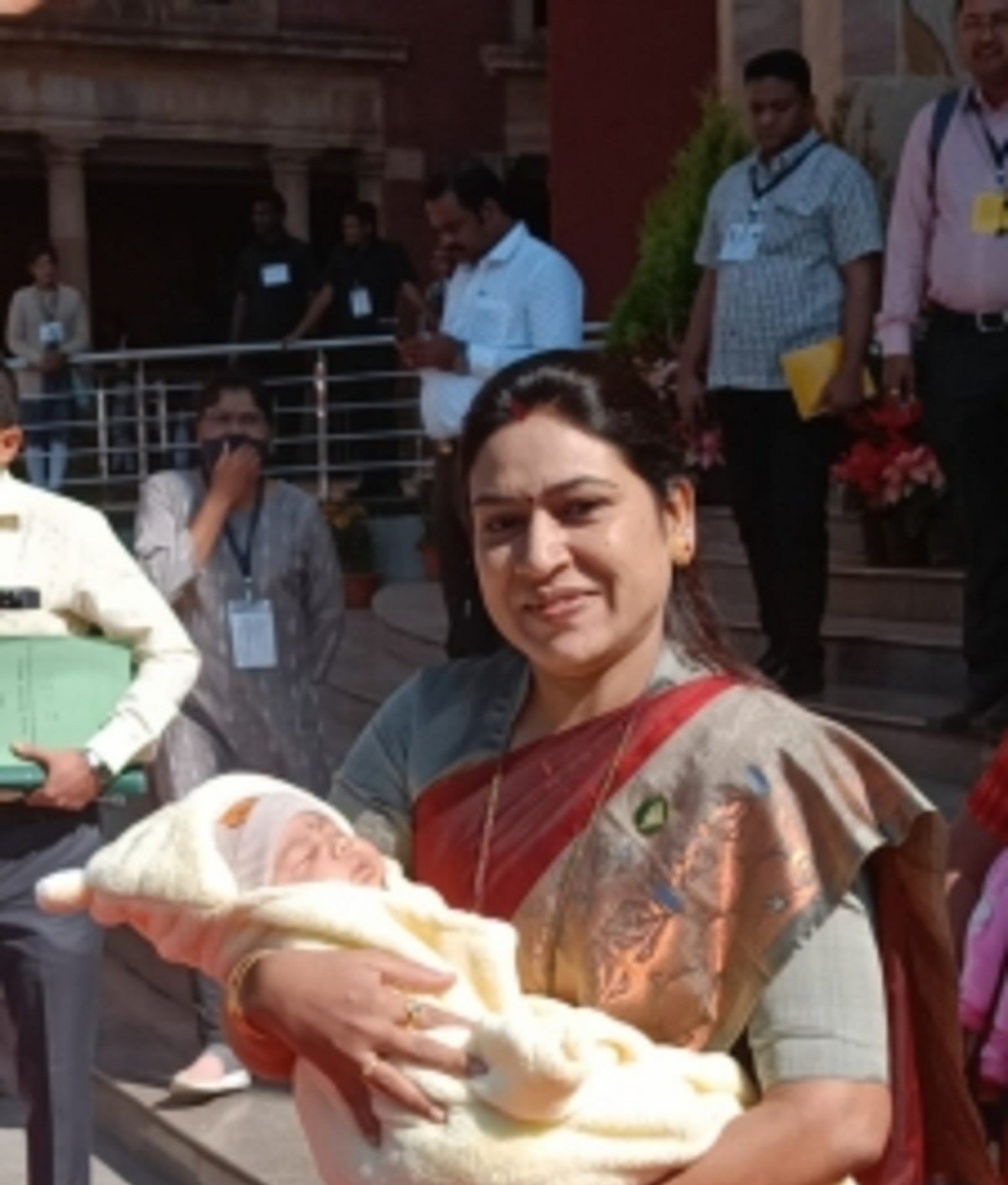 Cuddling baby in arms, NCP MLA attends Maharashtra legislature session
