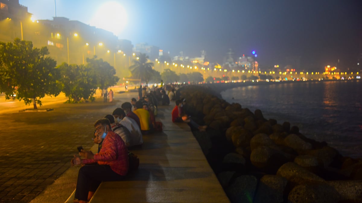 People spend time on New year's eve at Marine Drive on December 31, 2020 in Mumbai, India. 