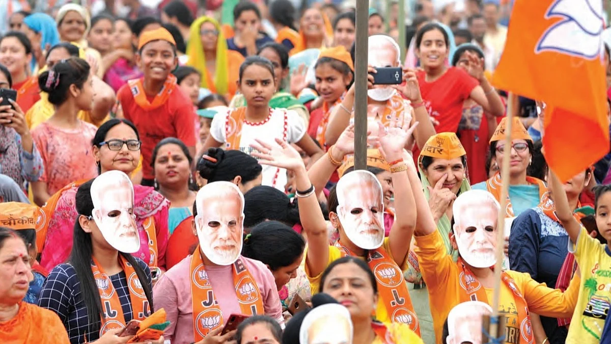 BJP supporters wear Modi masks at an election rally in Jammu. (Photo: Getty Images)