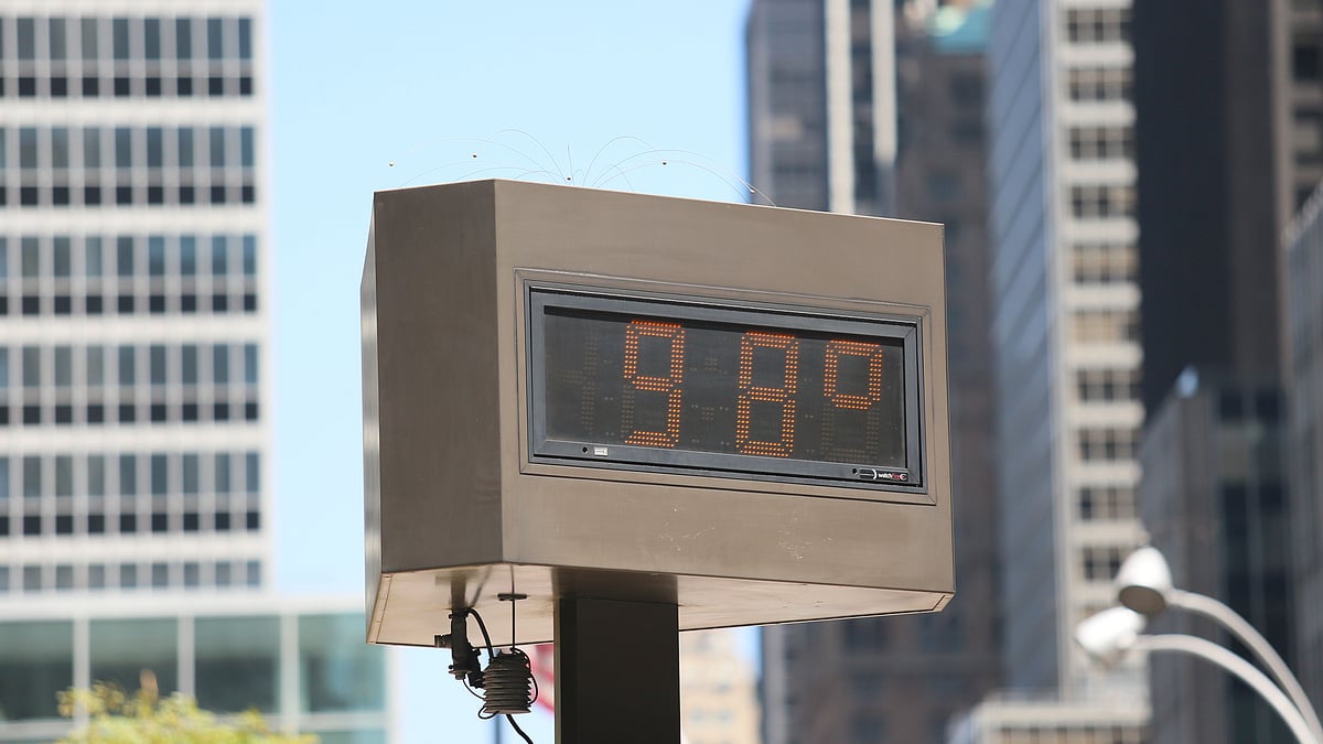 The current temperature is displayed on a board in New York city, the United States, on July 21, 2019. The highest temperature hit 36 degrees Celsius in New York City on Sunday as a result of a heat wave. (Xinhua/Zhang Fengguo/IANS)