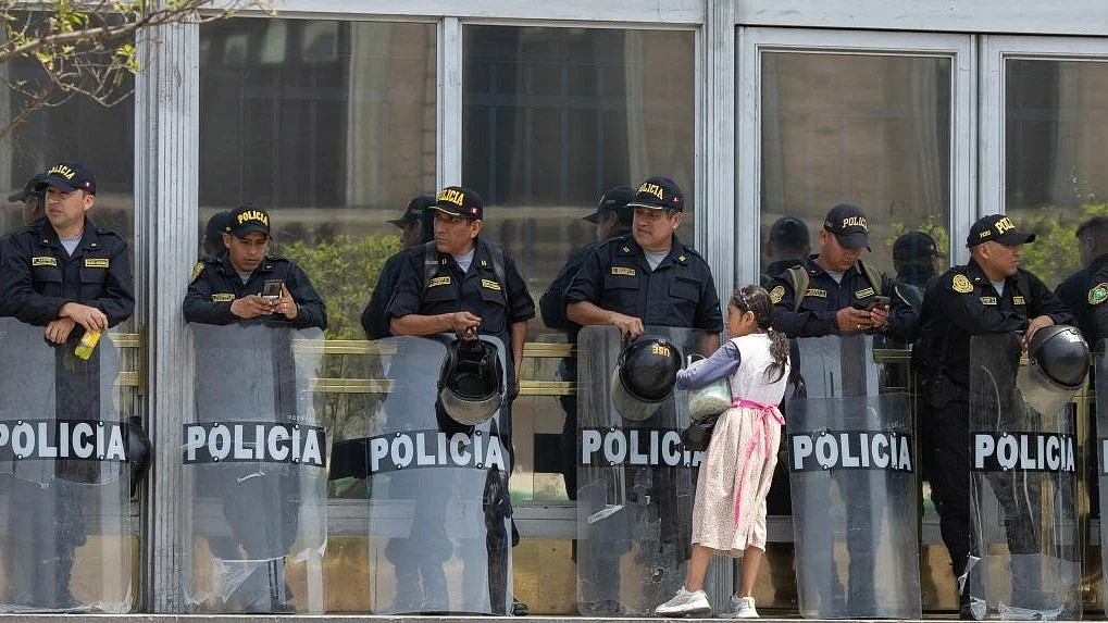 Police officers stand guard in Lima, Peru, Dec. 14, 2022.(Photo by Mariana Bazo/Xinhua/IANS)