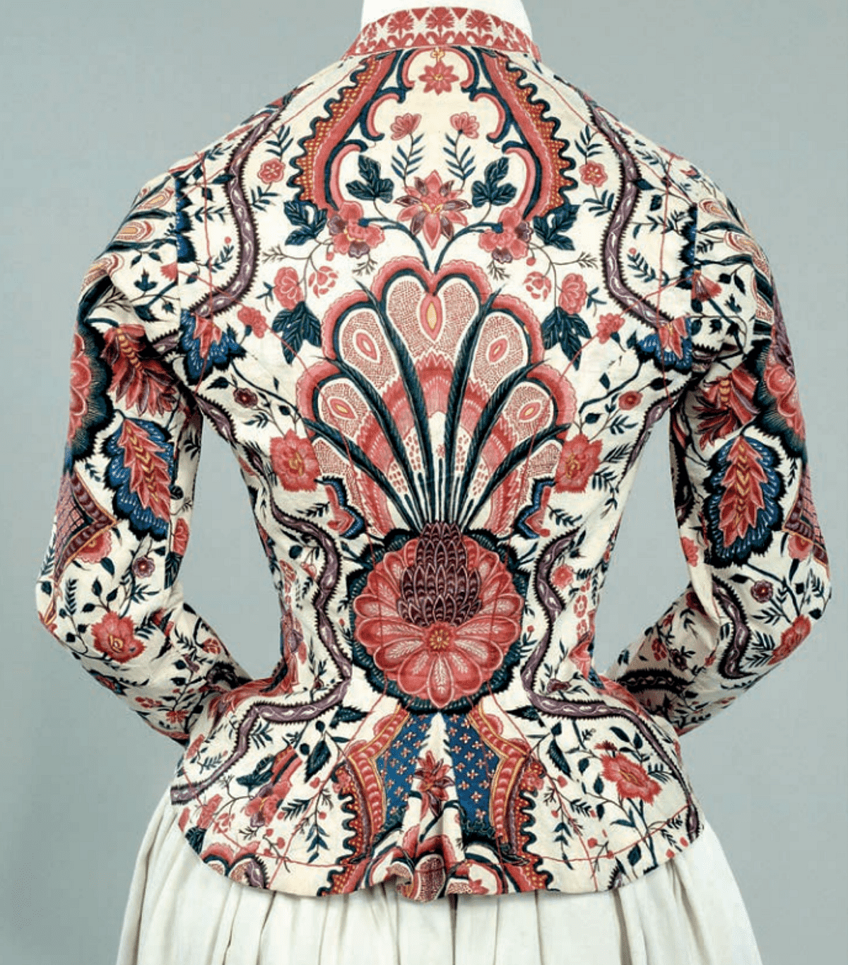 This fitted jacket 
was cut to display the sumptuous chintz imported from the Coromandel Coast