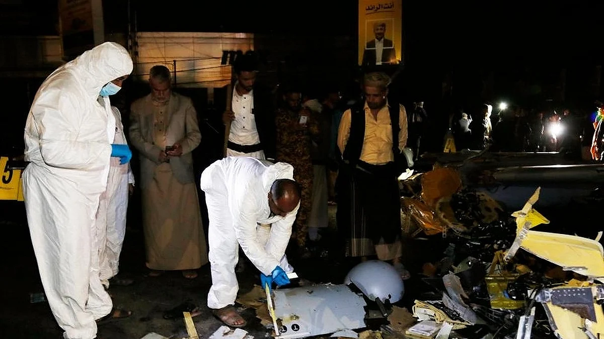 emeni people gather at the site where a drone crashed into a populous neighborhood in Sanaa, Yemen, on May 23, 2022. (Photo by Mohammed Mohammed/Xinhua/IANS)