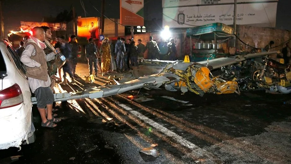 Yemeni people gather at the site where a drone crashed into a populous neighborhood in Sanaa, Yemen, on May 23, 2022. (Photo by Mohammed Mohammed/Xinhua/IANS)