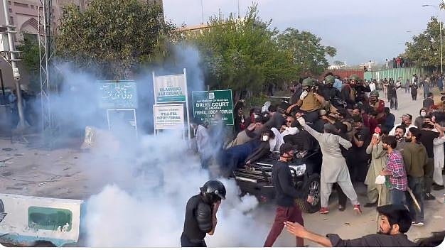 Former PM Imran Khan's supporters clash with police outside Islamabad court complex, 18 March