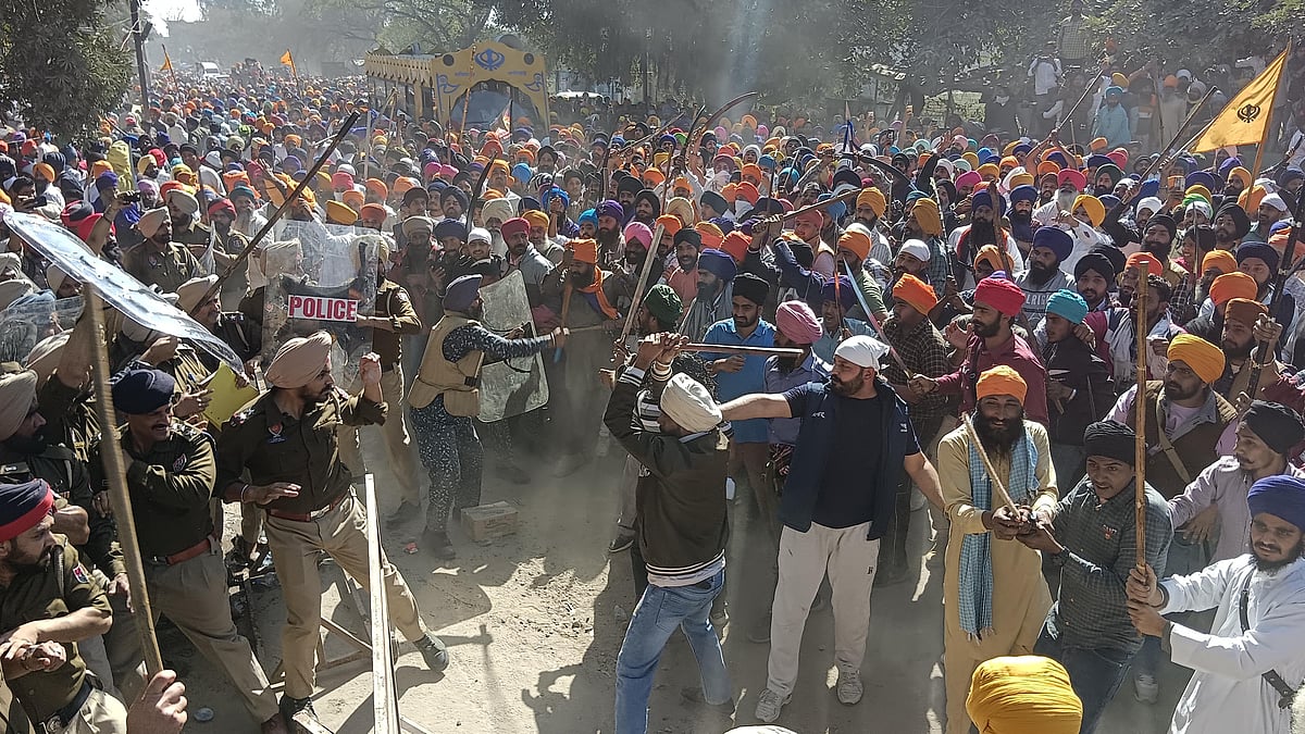 Supporters of Waris Punjab De chief Amritpal Singh clashing with Punjab Police personnel on Ajnala, Amritsar, 23 Feb 2023.