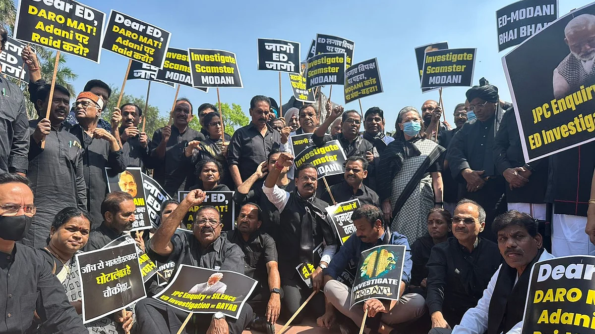 The opposition leaders met on Monday at Parliament complex on Monda with posters demanding a probe on the Adani scam 