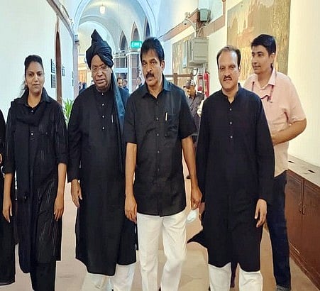 An old picture of Congress president Mallikarjun Kharge and other MPs in black cloths 