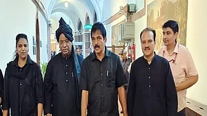 An old picture of Congress president Mallikarjun Kharge and other MPs in black cloths