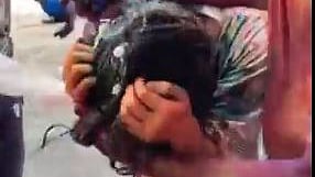 A Japanese tourist woman being molested in Delhi on Holi