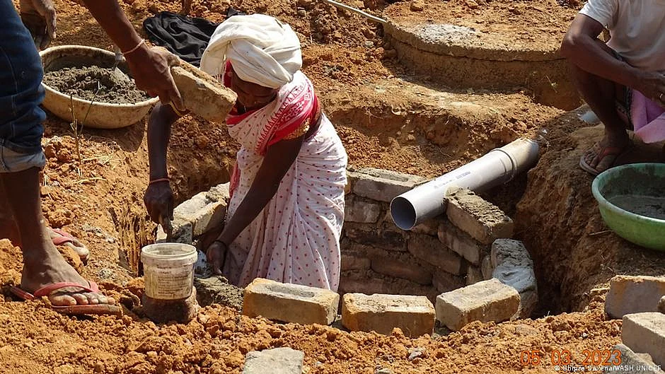 Women construction workers at work—a happy side effect of better sanitation in the community (photo: DW)