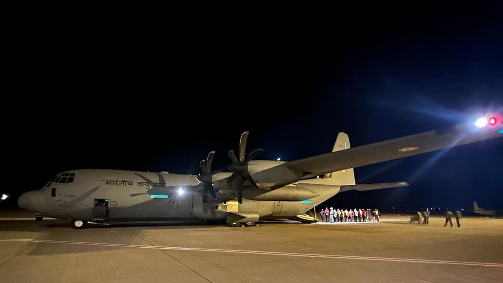 Indians rescued from Sudan deboarding the flight