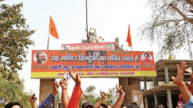 A new board outside the Dasna Devi temple in UP’s Ghaziabad announces the ban on entry of Muslims. (Photo: Getty Images)