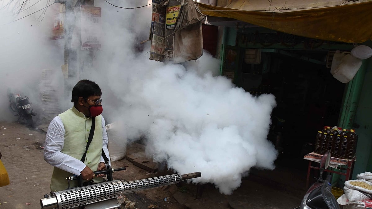 A volunteer fumigates the area as a precautionary measures against dengue and malaria, in Patna on Thursday April 15, 2021. (Source: Indrajit Dey/IANS)