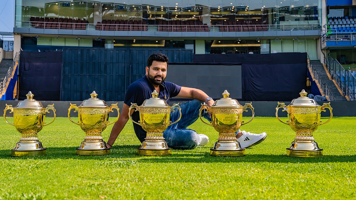Rohit poses at the Wankhede Stadium with the five IPL trophies Mumbai Indians won under his captaincy. (Photo: Mumbai Indians)