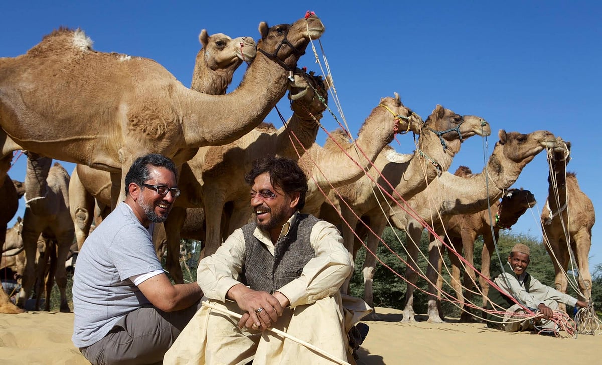Director Anup Singh with Irrfan Khan on sets, alongside a caravan of camels 