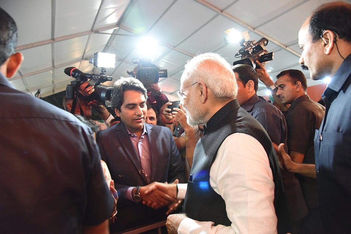 PM Modi with controversial ex Zee News editor, Sudhir Chaudhary 