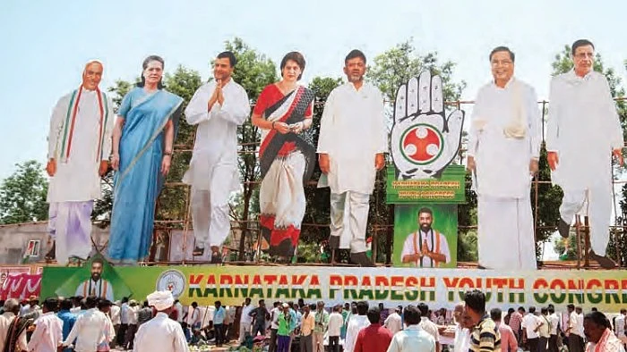 Cutouts of Congress leaders Mallikarjun Kharge, Sonia Gandhi, Rahul Gandhi, Priyanka Gandhi, DK Shivakumar, Siddaramaiah and Randeep Surjewala