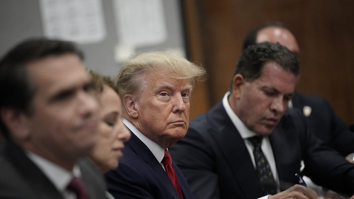 Former U.S. President Donald Trump with his defence team in a Manhattan court during his arraignment on April 4.