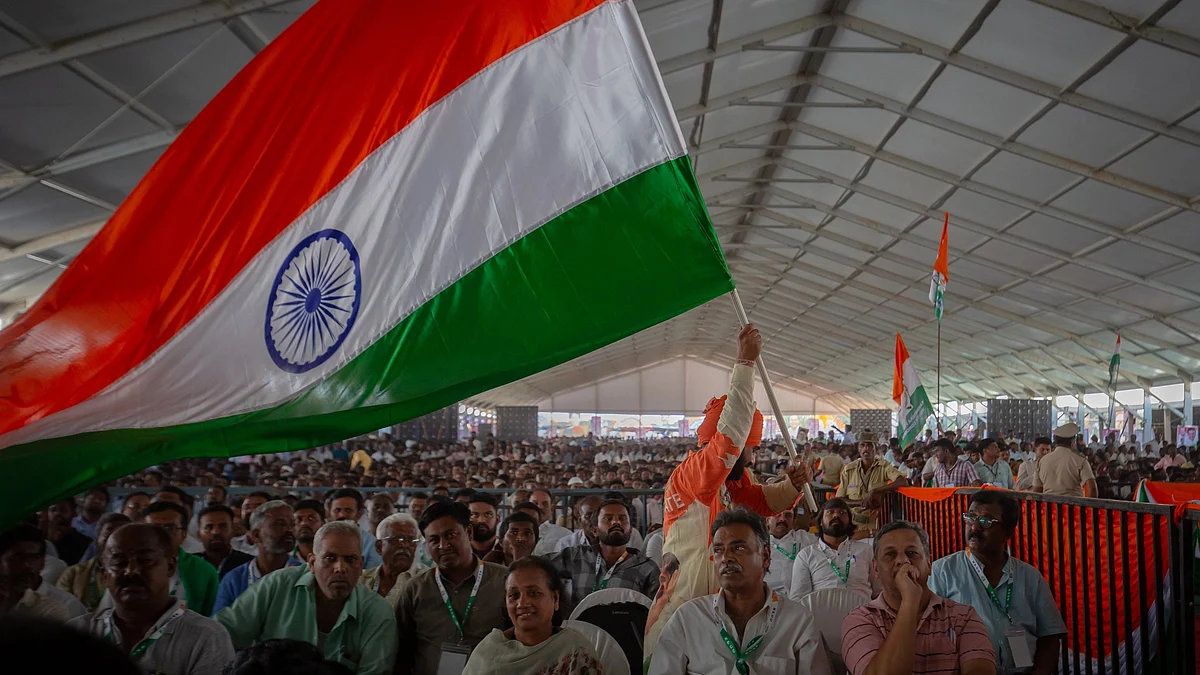 A man waves the Indian national flag as he attends an election rally of the Indian National Congress on April 16, 2023 in Kolar, India ahead of the Karnataka Polls. (Photo: Getty Images)