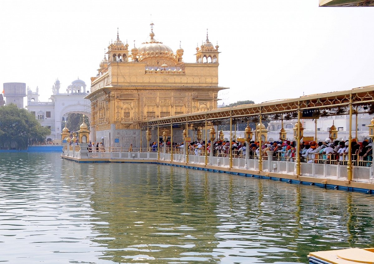 Sikh Devotees wait to offer prayers at the Golden Temple on the occasion of Baisakhi, in Amritsar, on Friday, April 14, 2023. (Photo: Pawan sharma/IANS)