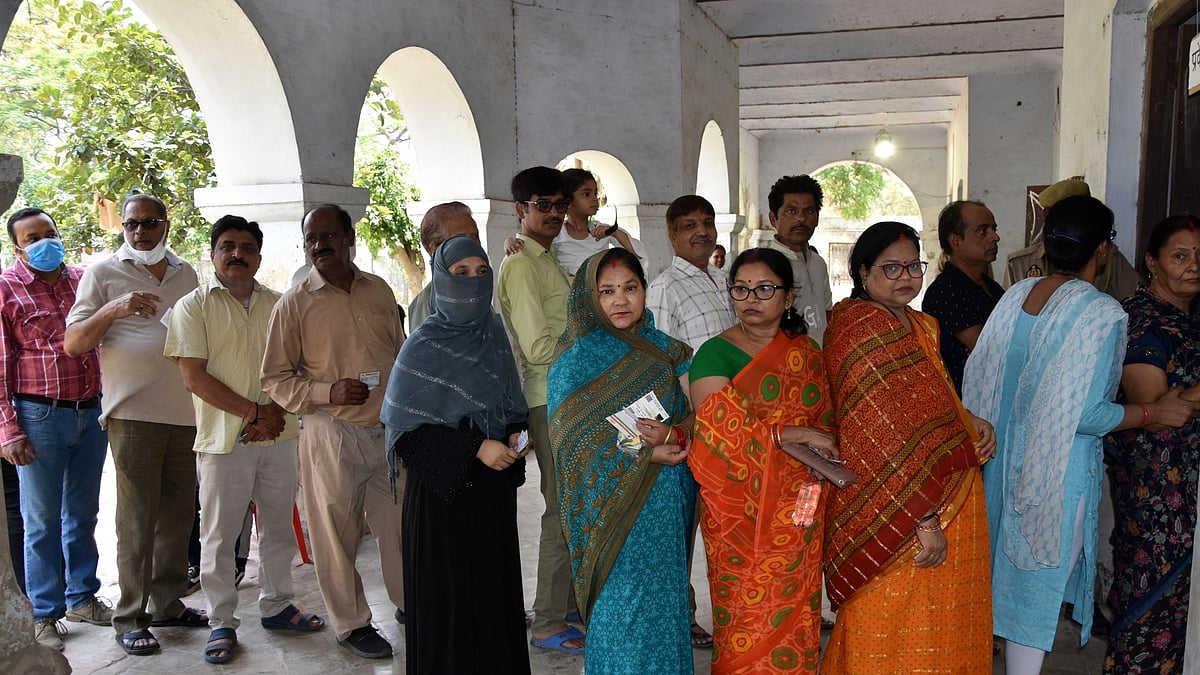 Voters stand in a queue to cast their vote for the UP Municipal elections, in Lucknow on Thursday, May 04, 2023. (Photo: IANS/Phool Chandra)