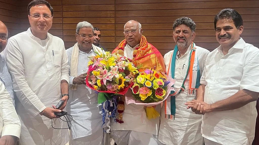 Congress president Mallikarjun Kharge with KPCC chief D.K. Shivakumar and former CM Siddaramaiah. Photo courtesy: @INC/Twitter