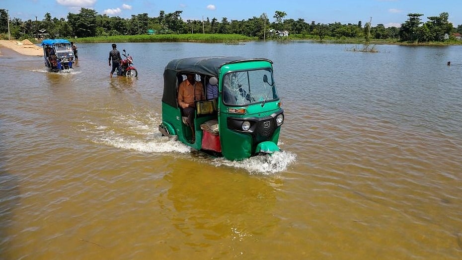 Rickshaws move through a flooded road in Sunamganj, Bangladesh, on July 3, 2022. (Photo: Xinhua/IANS)