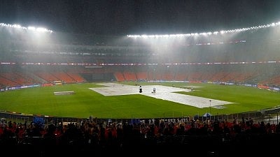 Spectators at the Motera stadium in Ahmedabad wait for the rain to stop  (Photo: IANS)