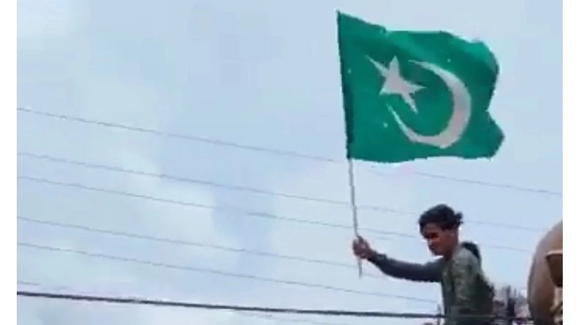 Screen-grab from the video showing a man waving the Islamic flag