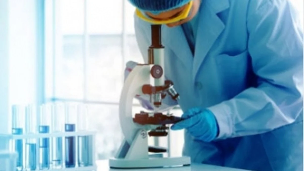 A scientist looking into a microscope (IANS Photo)